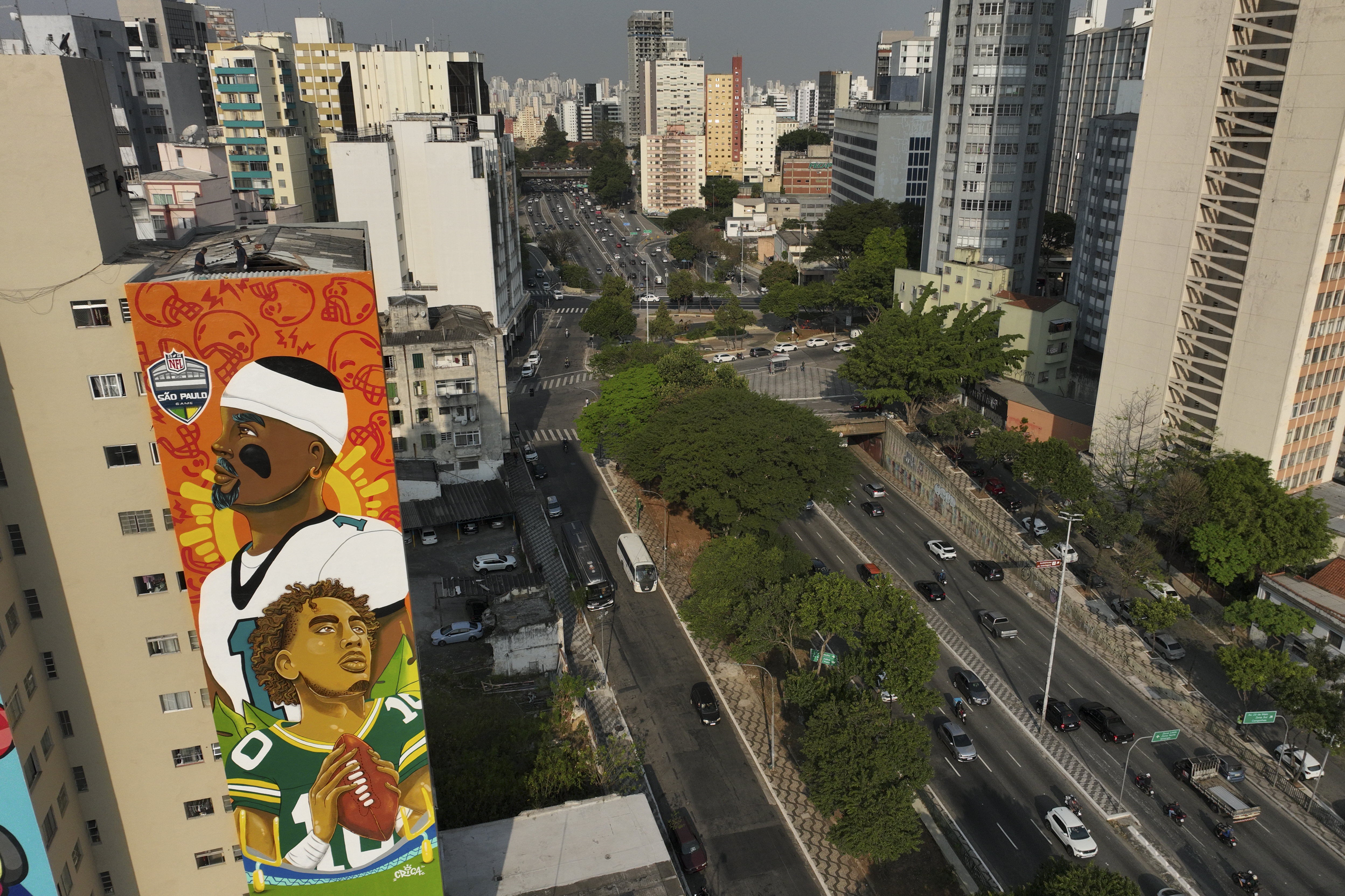 Jalen Hurts and Jordan Love depicted on large mural in São Paulo, Brazil.