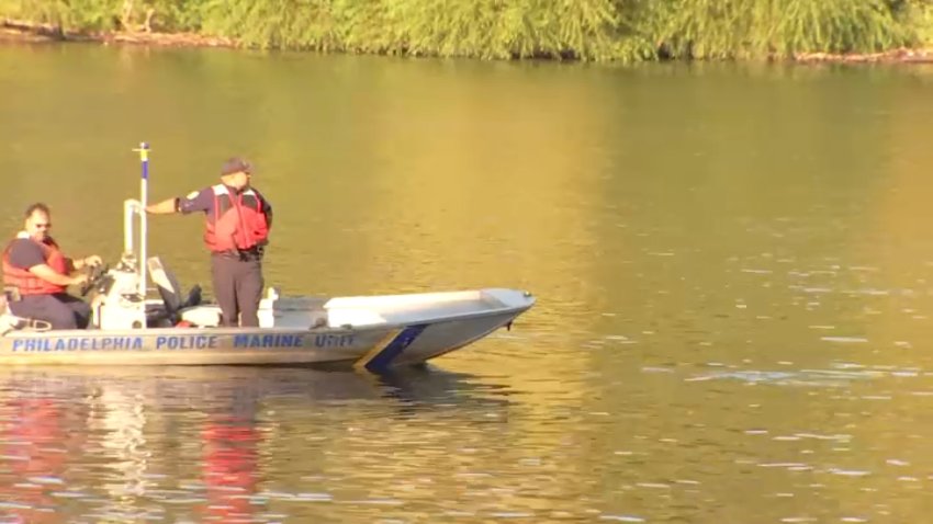 Police on boat on Schuylkill River