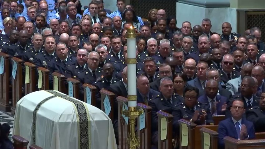 Police officer lined up next to coffin of Philadelphia Police Officer Jaime Roman