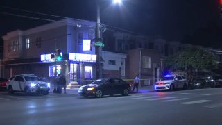 Police investigate after a man was shot at the intersection of Torresdale Avenue and Hellerman Street in Northeast Philadelphia early Thursday.