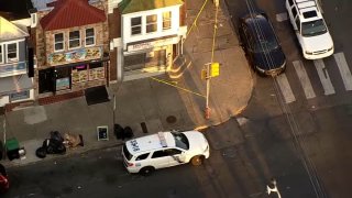 Police car and yellow caution tape around the Hong Kong Chinese Restaurant after the owner was stabbed