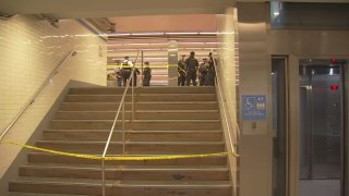 Police on SEPTA platform behind yellow tape