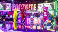 Character actors from the Epic Games Fortnite video game dance during the E3 Electronic Entertainment Expo in Los Angeles, on June 12, 2019.