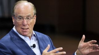 Andrew Ross Sorkin speaks with BlackRock CEO Larry Fink during the New York Times DealBook Summit in the Appel Room at the Jazz at Lincoln Center in New York City on Nov. 30, 2022.