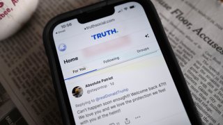 Republican presidential candidate and former President Donald Trump’s social media platform Truth Social is shown on a cell phone in Chicago on March 25, 2024.