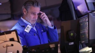 Traders work on the floor of the New York Stock Exchange during afternoon trading on April 9, 2024.