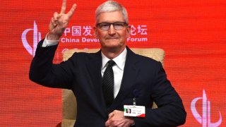 Apple’s Chief Executive Officer Tim Cook gestures during the China Development Forum in Beijing on March 24, 2024. 