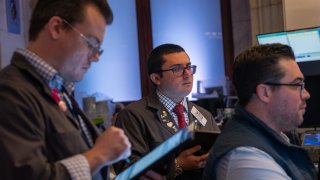 Traders work on the New York Stock Exchange (NYSE) floor on September 13, 2024, in New York City.