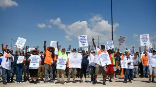 Dockworkers gather at the Bayport Container Terminal in Seabrook, Texas, on October 1, 2024.