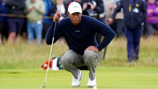 USA’s Tiger Woods lines up a putt on the 2nd during day two of The Open at Royal Troon, South Ayrshire, Scotland. Picture date: Friday July 19, 2024. 