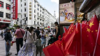 Chinese flags for sale on Nanjing East Road in Shanghai, China, on Wednesday, Oct. 2, 2024.