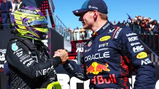 Race winner Lewis Hamilton of Great Britain and Mercedes and Second placed Max Verstappen of the Netherlands and Oracle Red Bull Racing celebrate in parc ferme during the F1 Grand Prix of Great Britain at Silverstone Circuit on July 07, 2024 in Northampton, England.