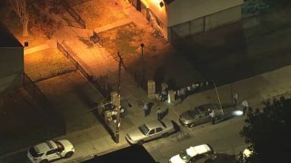 Police investigate the scene after a man was injured in a shooting along North 22nd Street in Philadelphia early Thursday, Oct. 31, 2024.