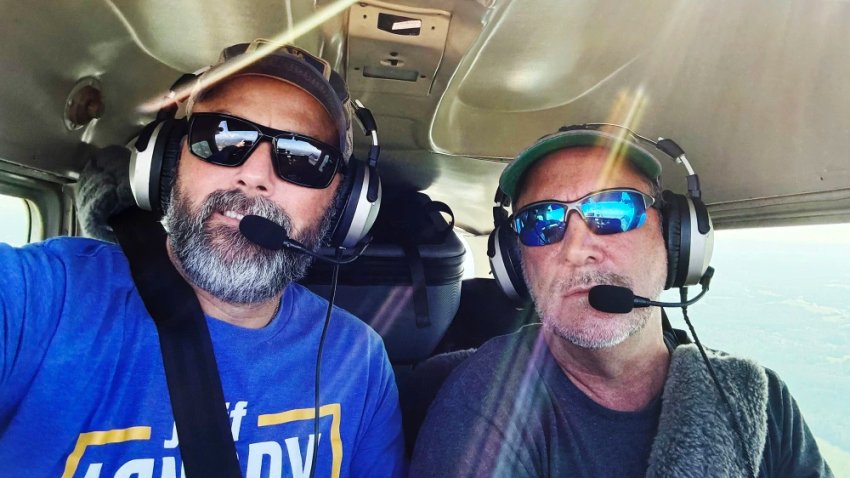 Justin Crossie, left, and Gerald Herbert during a flight Thursday from Concord, N.C., to Gatlinburg, Tenn., to deliver supplies.