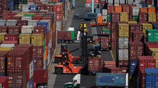 FILE - Containers are moved at the Port of New York and New Jersey