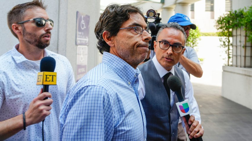 FILE - Dr. Mark Chavez, center, a physician from San Diego, who is charged in connection with actor Matthew Perry's death from an accidental ketamine overdose, arrives at the Roybal Federal Courthouse in Los Angeles, Friday, Aug. 30, 2024. (AP Photo/Damian Dovarganes, File)