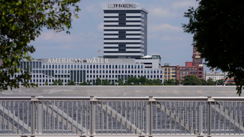 The largest regulated water and wastewater utility company in the U.S., American Water, its building in Camden, N.J., seen in the foreground on June 17, 2024, says it was the victim of a cyberattack, prompting the firm to pause billing to customers.