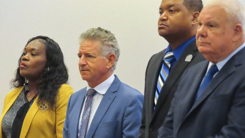 La'Quetta Small, the superintendent of schools for Atlantic City NJ, left, and her husband, Atlantic City Mayor Marty Small Sr., second from right, stand with their lawyers during a court appearance in Mays Landing, N.J., Thursday, Oct. 10, 2024.