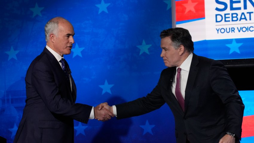 Pennsylvania Senate candidates Sen. Bob Casey, D-Pa., left, and Republican David McCormick shake hands