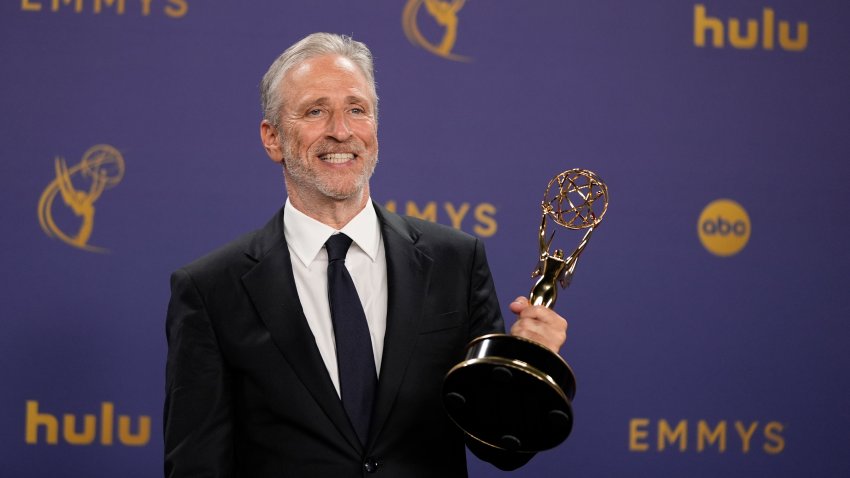 FILE – Jon Stewart poses in the press room with the award for outstanding talk series for “The Daily Show” during the 76th Primetime Emmy Awards on Sunday, Sept. 15, 2024, at the Peacock Theater in Los Angeles. (AP Photo/Jae C. Hong, File)