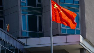 The Chinese flag flies outside the Chinese Consulate