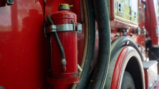 Firemen equipment on fire truck,Fire engine with equipment stay in the fire department.