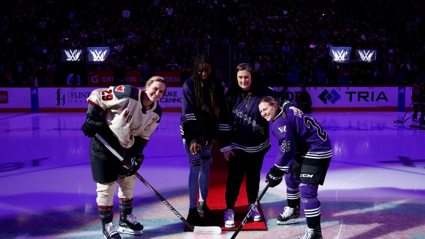 Women's hockey player in ceremonial faceoff