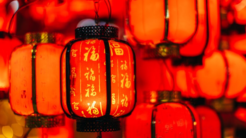 Red Chinese New Year lanterns hand at night