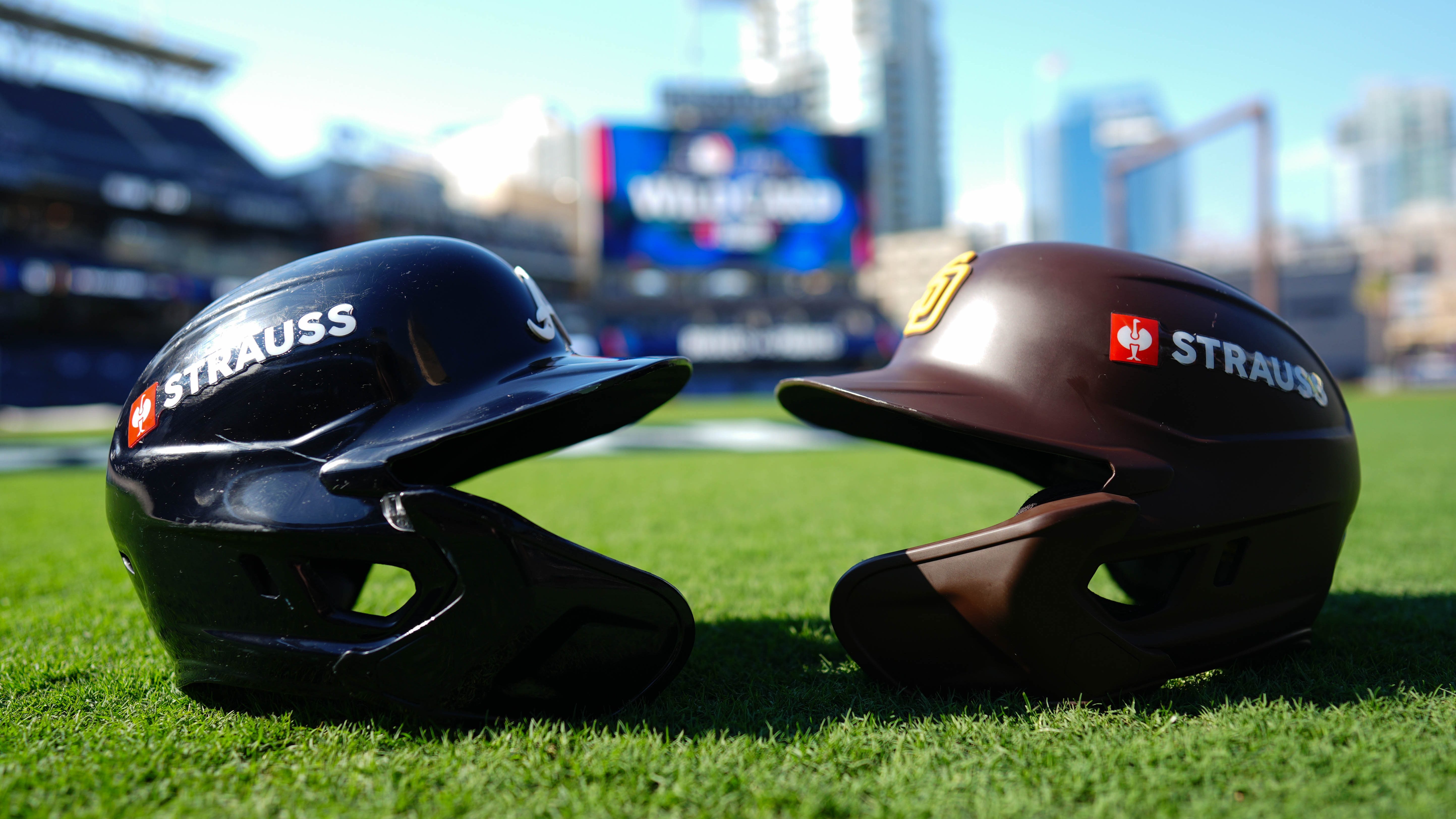 SAN DIEGO, CA - OCTOBER 01:  A detail photo of an Atlanta Braves helmet and a San Diego Padres helmet on the field prior to Game 1 of the Wild Card Series presented by T-Mobile 5G Home Internet between the Atlanta Braves and the San Diego Padres at Petco Park on Tuesday, October 1, 2024 in San Diego, California. (Photo by Daniel Shirey/MLB Photos via Getty Images)