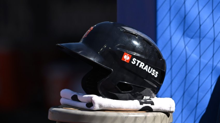 A Detroit Tigers helmet with a STRAUSS ad