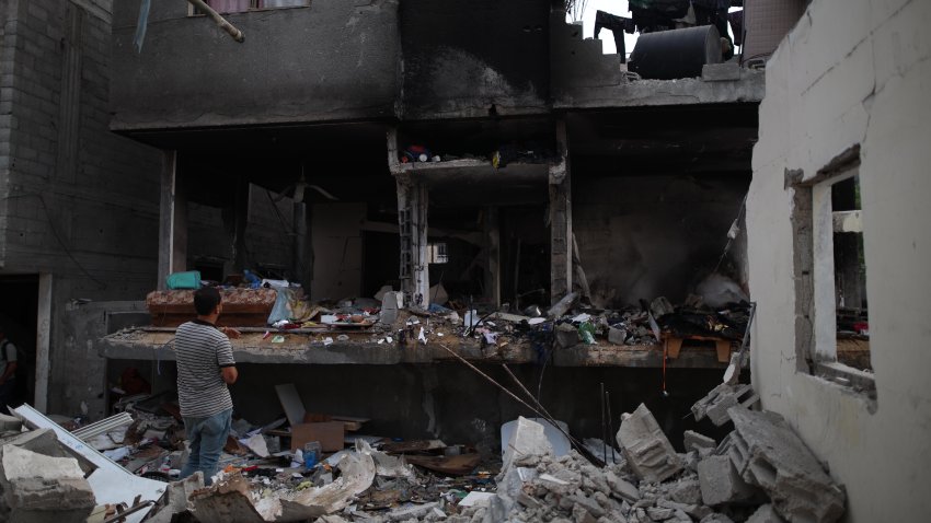 A Palestinian checks a destroyed house after it was attacked by the Israeli army in the al-Nuseirat refugee camp.