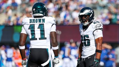 EAST RUTHERFORD, NEW JERSEY – OCTOBER 20: A.J. Brown #11 of the Philadelphia Eagles celebrates with teammate Saquon Barkley #26 of the Philadelphia Eagles during the first half against the New York Giants at MetLife Stadium on October 20, 2024 in East Rutherford, New Jersey. (Photo by Al Bello/Getty Images)