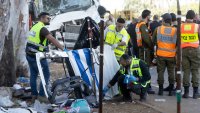 TEL AVIV, ISRAEL - OCTOBER 27: Authorities inspect debris from a truck after a truck hit people waiting at a bus stop near the Glilot junction on October 27, 2024 north of Tel Aviv, Israel. Dozens were reported injured in the initial aftermath of the suspected ramming attack.