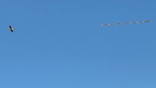 A banner reading “Go Birds! Sack Project 2025! Vote Kamala” is flown over South Philadelphia on Sunday, Oct. 13, 2024.