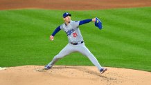 Oct 16, 2024; New York City, New York, USA; Los Angeles Dodgers pitcher Walker Buehler (21) throws a pitch against the New York Mets in the first inning during game three of the NLCS for the 2024 MLB playoffs at Citi Field. Mandatory Credit: John Jones-Imagn Images