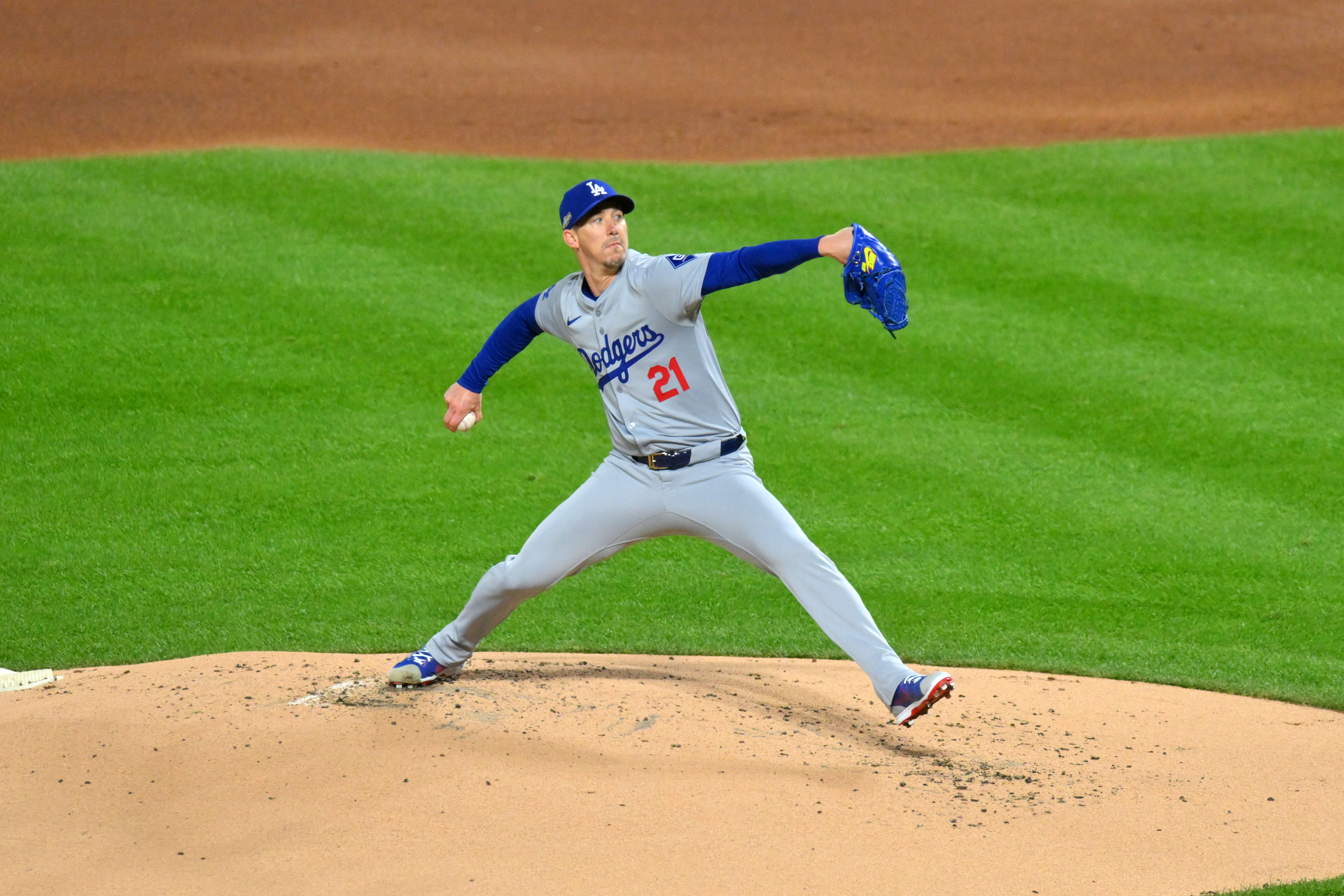 Oct 16, 2024; New York City, New York, USA; Los Angeles Dodgers pitcher Walker Buehler (21) throws a pitch against the New York Mets in the first inning during game three of the NLCS for the 2024 MLB playoffs at Citi Field. Mandatory Credit: John Jones-Imagn Images