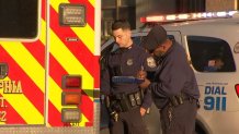 Police investigators at the scene after an EMT was attacked in an ambulance in North Philadelphia on Thursday morning.