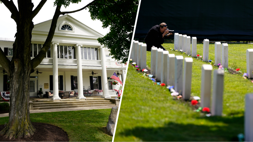 A building that formed part of the Carlisle Indian Industrial School campus is seen at U.S. Army's Carlisle Barracks, June 10, 2022, in Carlisle, Pa. and A member of the media photographs headstones at the cemetery of the U.S. Army's Carlisle Barracks, June 10, 2022, in Carlisle, Pa.