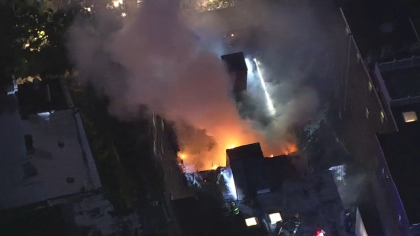 Burning home at night