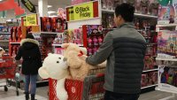 A customer pushes a shopping cart containing stuffed toys at a Target Corp. store in the Queens borough of New York, U.S, on Thursday, Nov. 28, 2019.