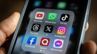 Logos of online social media and social networking sites displayed on a smartphone screen on August 01, 2023 in Bath, England.