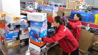 Employees package and sort express parcels at an e-commerce company on Nov. 1, 2024, around the Double 11 Shopping Festival in Lianyungang, Jiangsu Province of China.