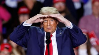 Former US President and Republican presidential candidate Donald Trump gestures as he speaks during a campaign rally at Van Andel Arena in Grand Rapids, Michigan on November 5, 2024.