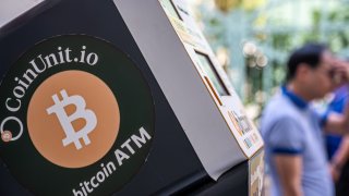 Signage for Bitcoin cryptocurrency on a cryptocurrency ATM, operated by Coinunit.io, in Hong Kong, China, on Wednesday, Nov. 6, 2024. 