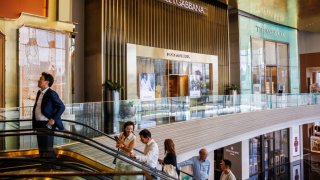 The storefronts of Dolce & Gabbana, Tiffany & Co. and Patek Philippe are seen as people enter Icon Siam, a luxury shopping mall located on the Chao Phraya River, on June 12, 2024 in Bangkok, Thailand. 