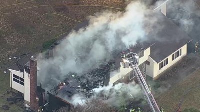 Flames tear through NJ house