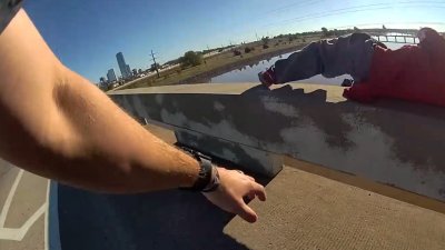 WATCH: Police officer saves sleeping man as he rolls off bridge