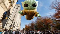 Baby Yoda, also known as the Grogu balloon floats