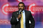 Kash Patel speaks during a Turning Point Action