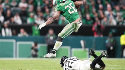 PHILADELPHIA, PA – NOVEMBER 03: Philadelphia Eagles running back Saquon Barkley (26) leaps over a tackle attempt by Jacksonville Jaguars cornerback Ronald Darby (25) during the game between the Philadelphia Eagles and the Jacksonville Jaguars on November 3, 2024 at Lincoln Financial Field in Philadelphia, PA. (Photo by Andy Lewis/Icon Sportswire via Getty Images)